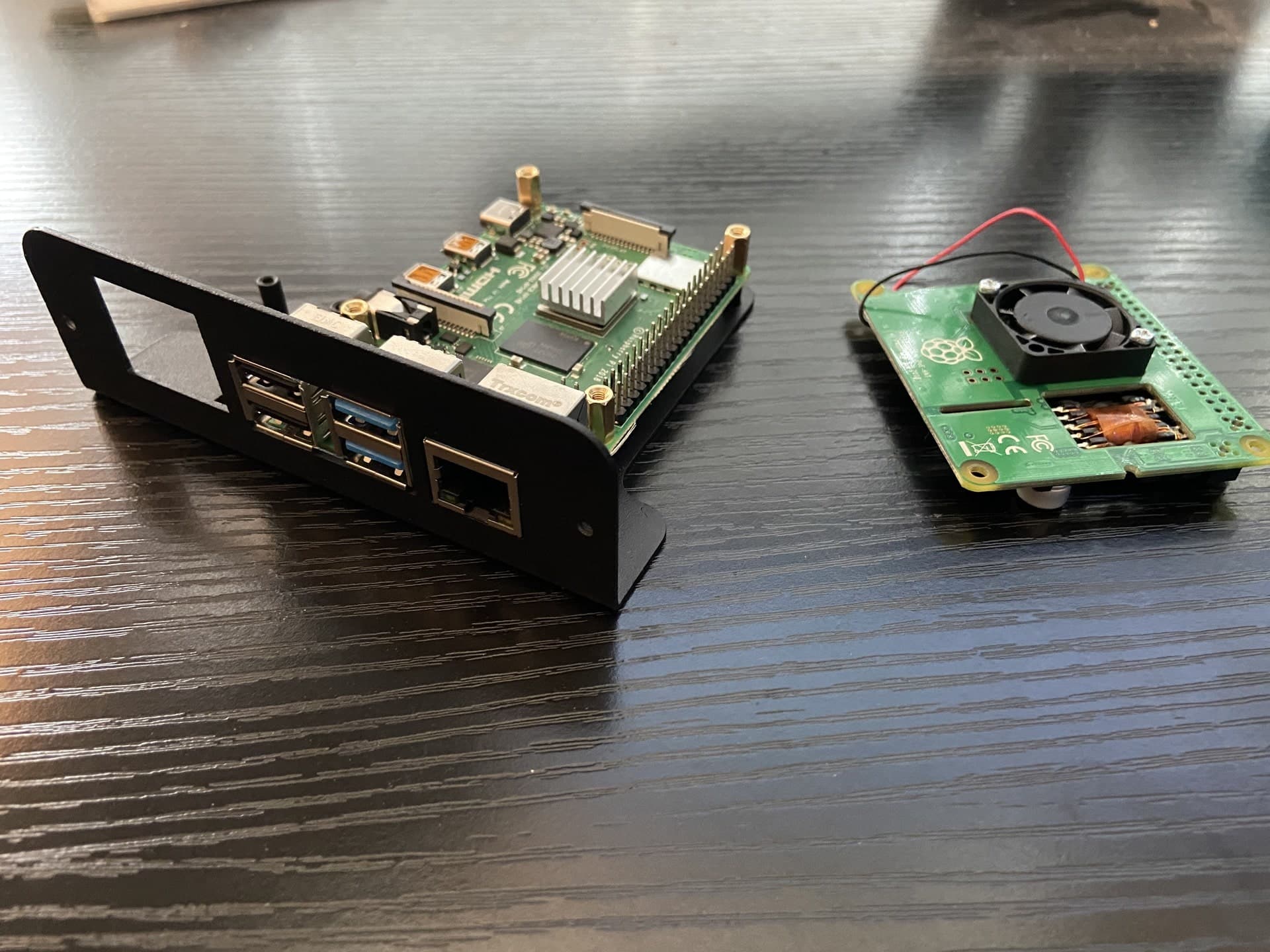 A Raspberry Pi in a 2U rack sled with a PoE HAT beside it